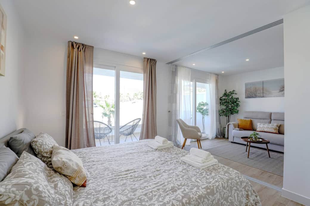 Peaceful bedroom with king bed and terrace access. Peaceful bedroom with king bed and terrace access.