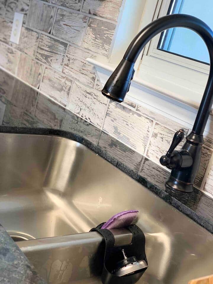 Pull down faucet with low divide stainless sink