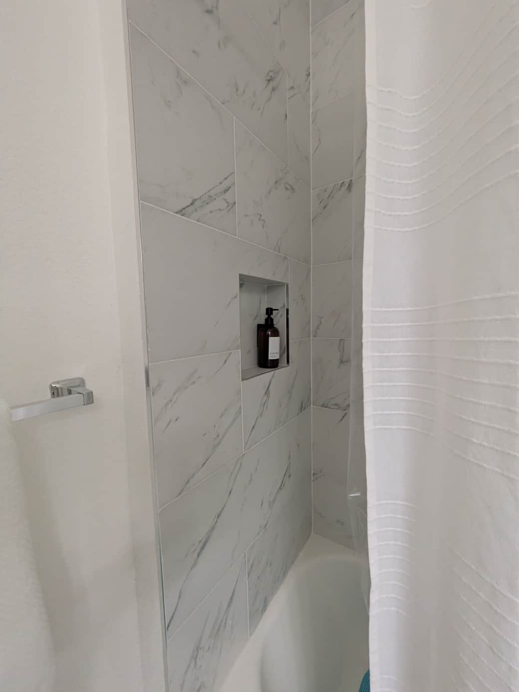 Luxury shower bar with bath products.