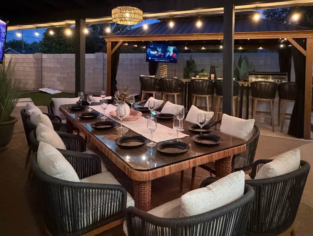 Gather together for unforgettable meals with outdoor dining for 12 under café lights, while the covered bar seating for 6 and nearby TV lounge offer additional space to relax and connect.