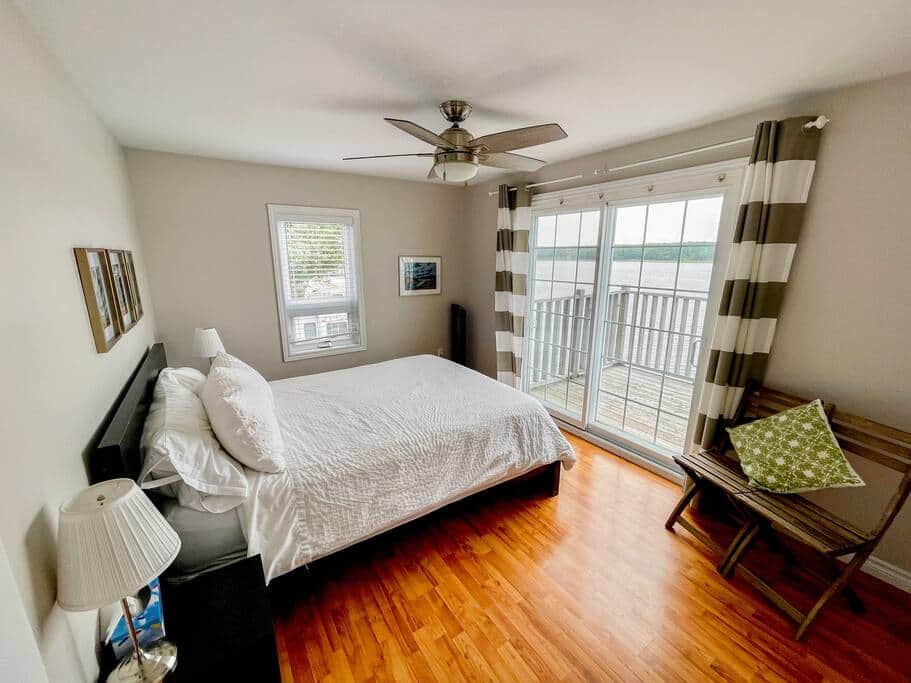 Bedroom with king bed and walk-out to deck Bedroom with king bed and walk-out to deck