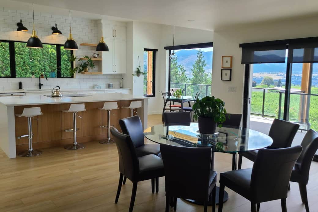 A lovely dining area with a round table to promote easy flowing conversations. Covered decks provide the perfect amount of shade.