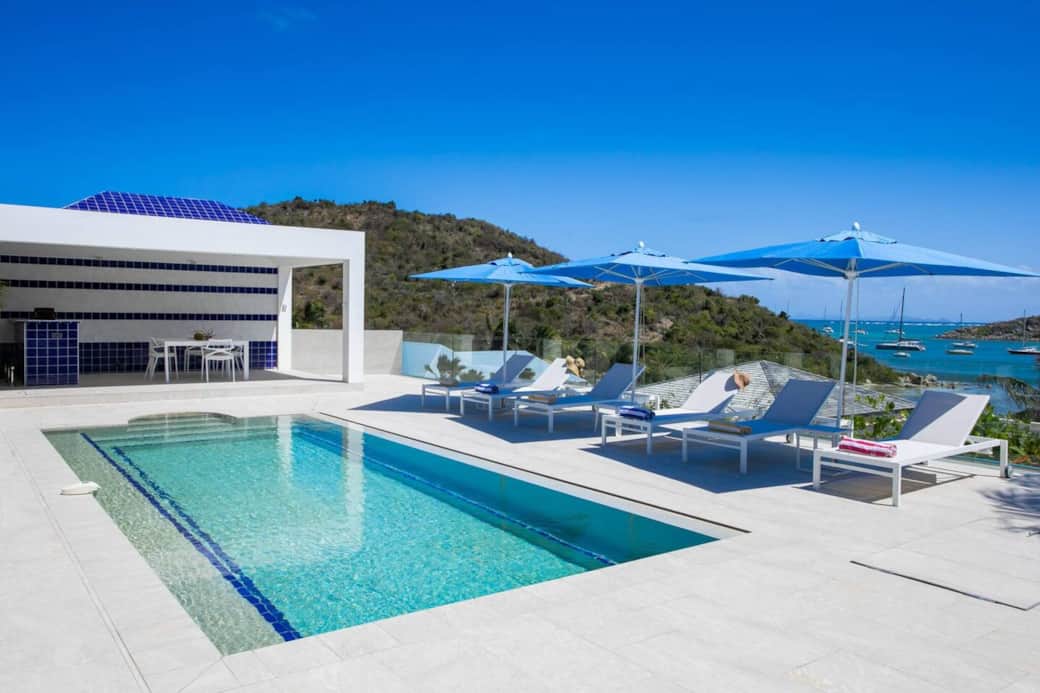 Swimming pool with deck chairs, terrace, and outdoor kitchen Azur