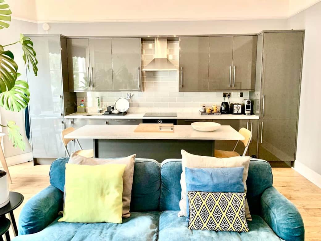 Living Room: The open-plan kitchen/living area is bathed in natural light