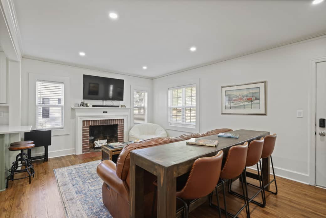 Open family room by the kitchen with smart TV and comfortable seating