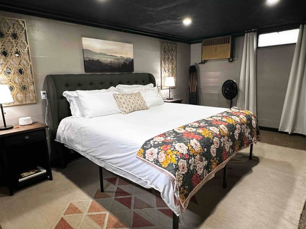A king sized bed in our cozy bedroom setting.