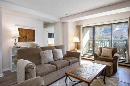 Plush sofa and chairs to relax in front of the electric fireplace