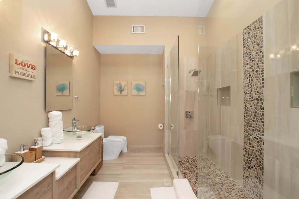 Luxurious main bath with double sinks and double shower.