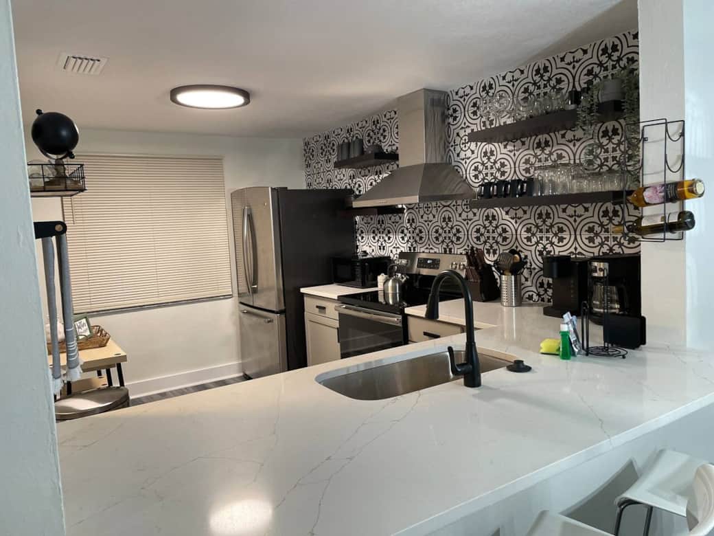 Cozy kitchen featuring a wine rack and coffee bar with wine and coffee included.