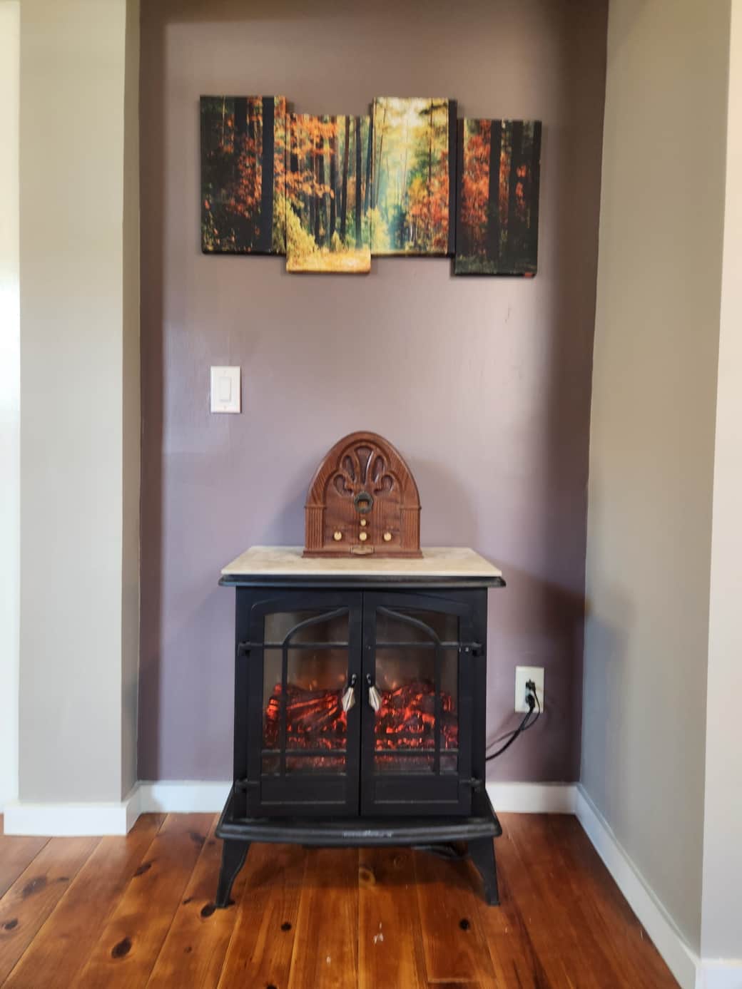 Bedroom 1 with electric fireplace - ceiling fan- chaise lounge