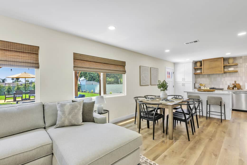Unwind in our bright, airy living room with a cozy sofa and warm, inviting ambiance. Unwind in our bright, airy living room with a cozy sofa and warm, inviting ambiance.