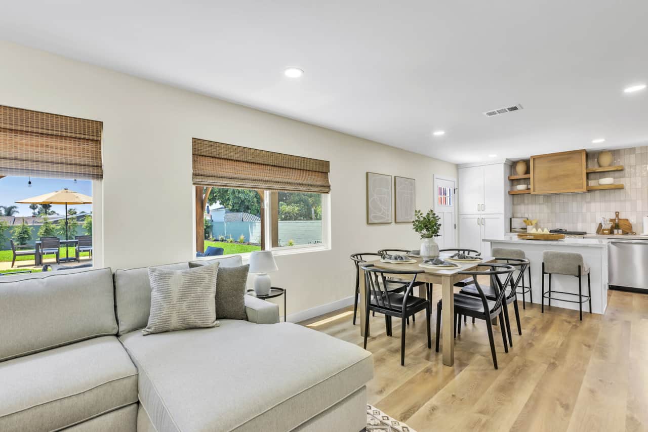 Unwind in our bright, airy living room with a cozy sofa and warm, inviting ambiance.