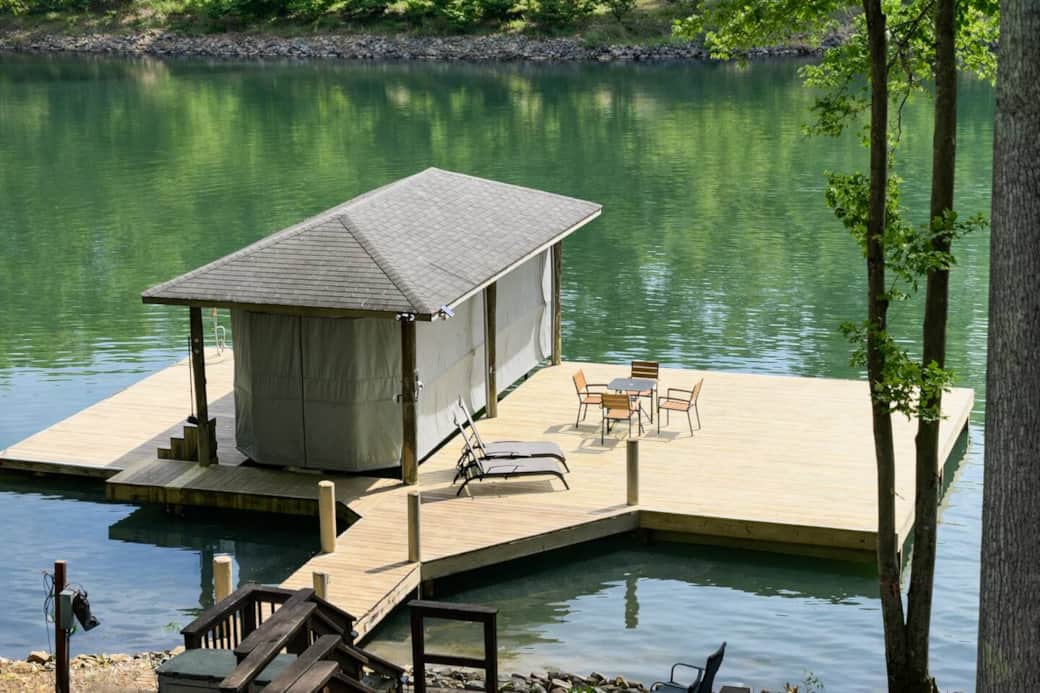 Two private docks with seating and easy water access, perfect for swimming, lounging, and boating in a quiet cove