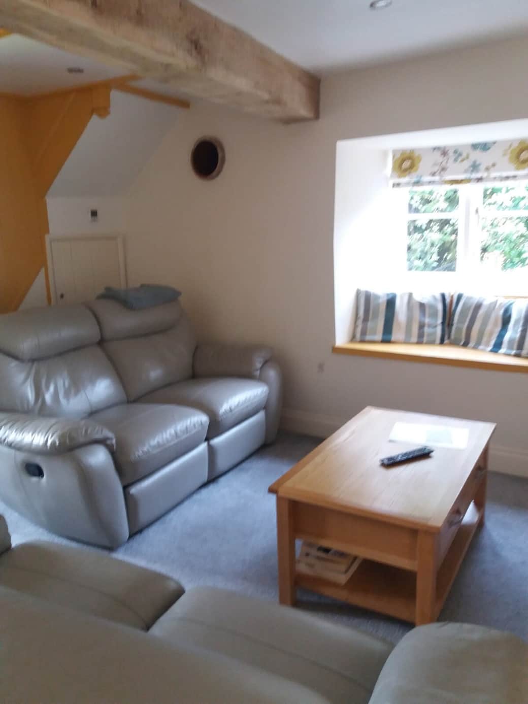 This room Is the front room ..
there Is a T.V and wood burner.