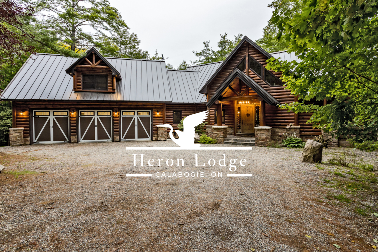 Welcome to Heron Lodge! Spacious parking with a 3-bay garage for up to 16 guests. 
