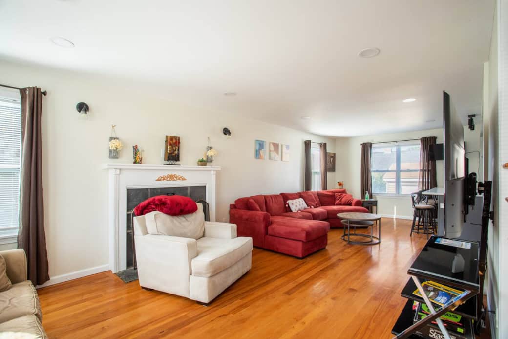 Living Room: Bright and inviting space, perfect for lounging or game nights with friends!