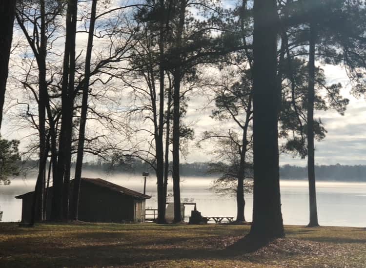 The original 1950s boathouse with a sunrise view