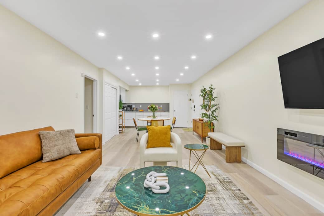 Modern open-concept living space with stylish decor, cozy seating & ambiance. Modern open-concept living space with stylish decor, cozy seating & ambiance.