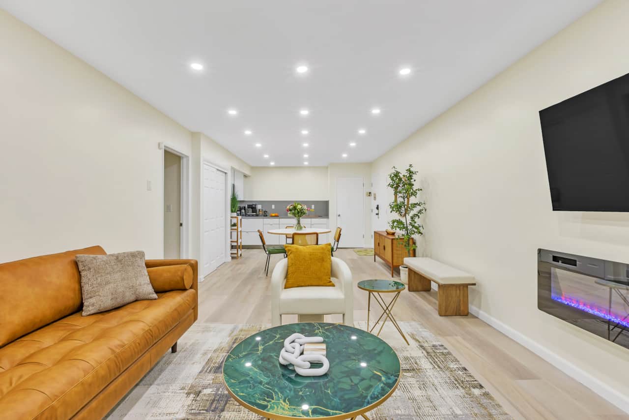 Modern open-concept living space with stylish decor, cozy seating & ambiance.