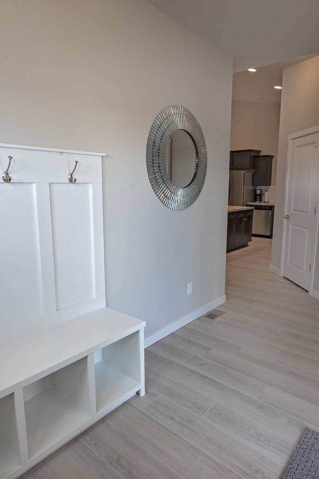 Foyer welcomes you home with a place to hang your coat and store your footwear.