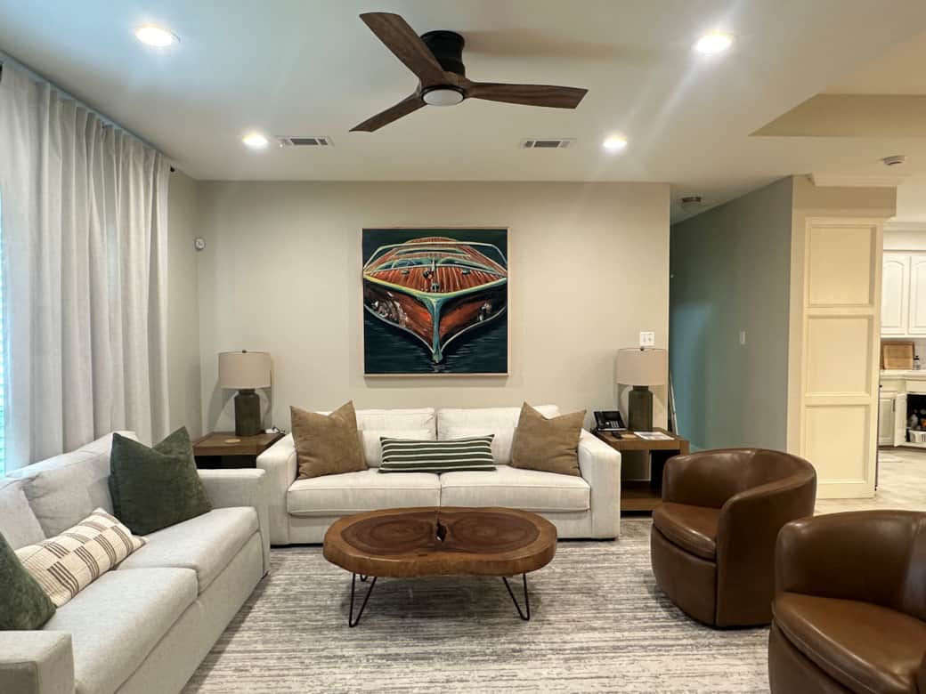 Living Room: Large TV for entertainment.  The two chairs can swivel to face the living room or the dining/kitchen area.  Sleep three in this room.  Pull out sofa bed with memory mattress next to the window, and an oversized sofa for a single bed.