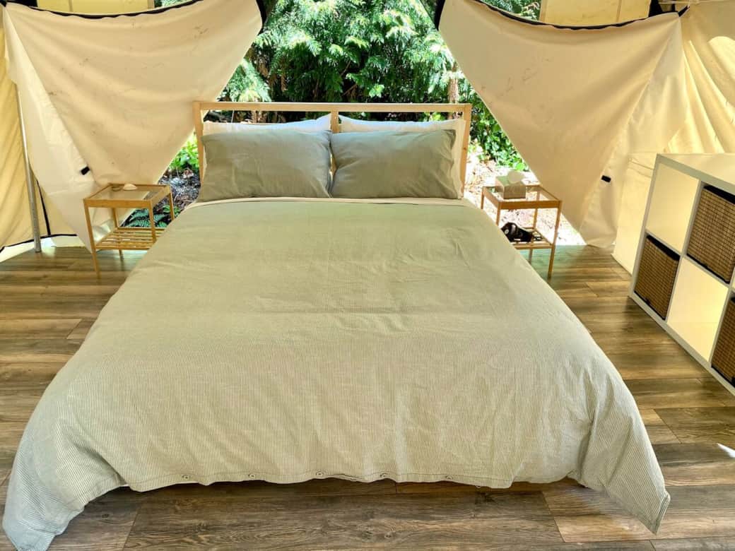 Very comfortable queen-size bed with storage drawers underneath. Back of tent shown open here. Very comfortable queen-size bed with storage drawers underneath. Back of tent shown open here.