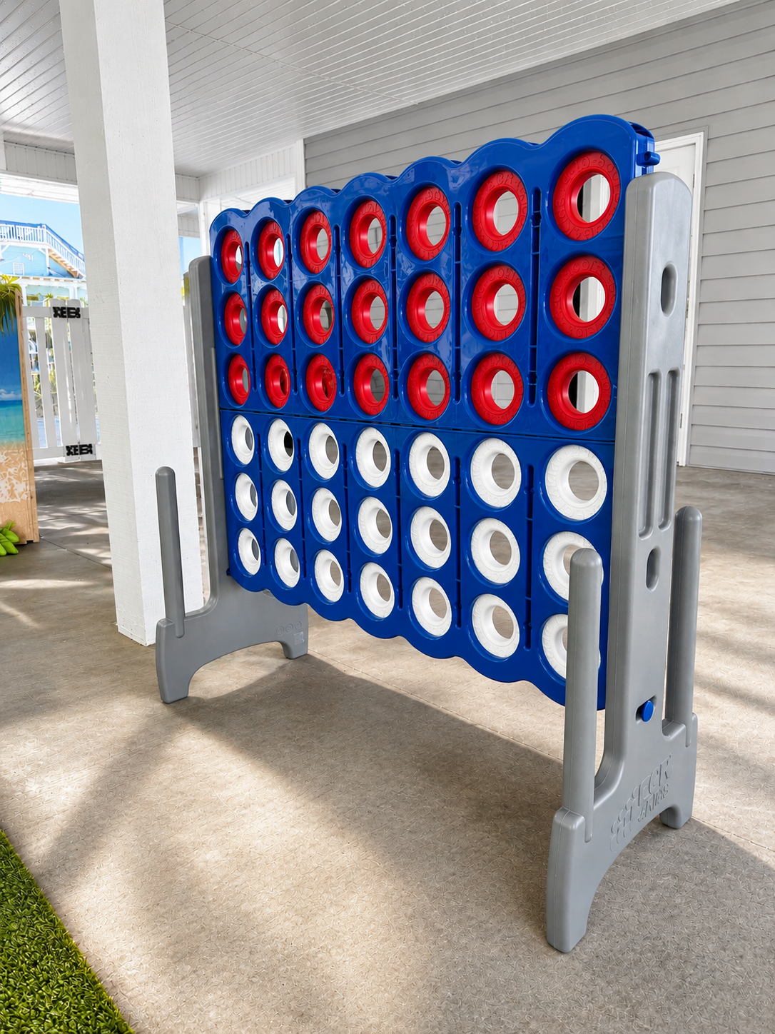 Giant Connect Four game beneath the covered patio