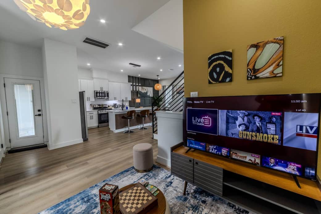 Colorful Game Room with Extra Sleeping Space
-Smart TV for movie nights, gaming  and streaming favorite shows
-Coffee table for snacks, games, or puzzles
-Dedicated desk for remote work  Colorful Game Room with Extra Sleeping Space
-Smart TV for movie nights, gaming  and streaming favorite shows
-Coffee table for snacks, games, or puzzles
-Dedicated desk for remote work