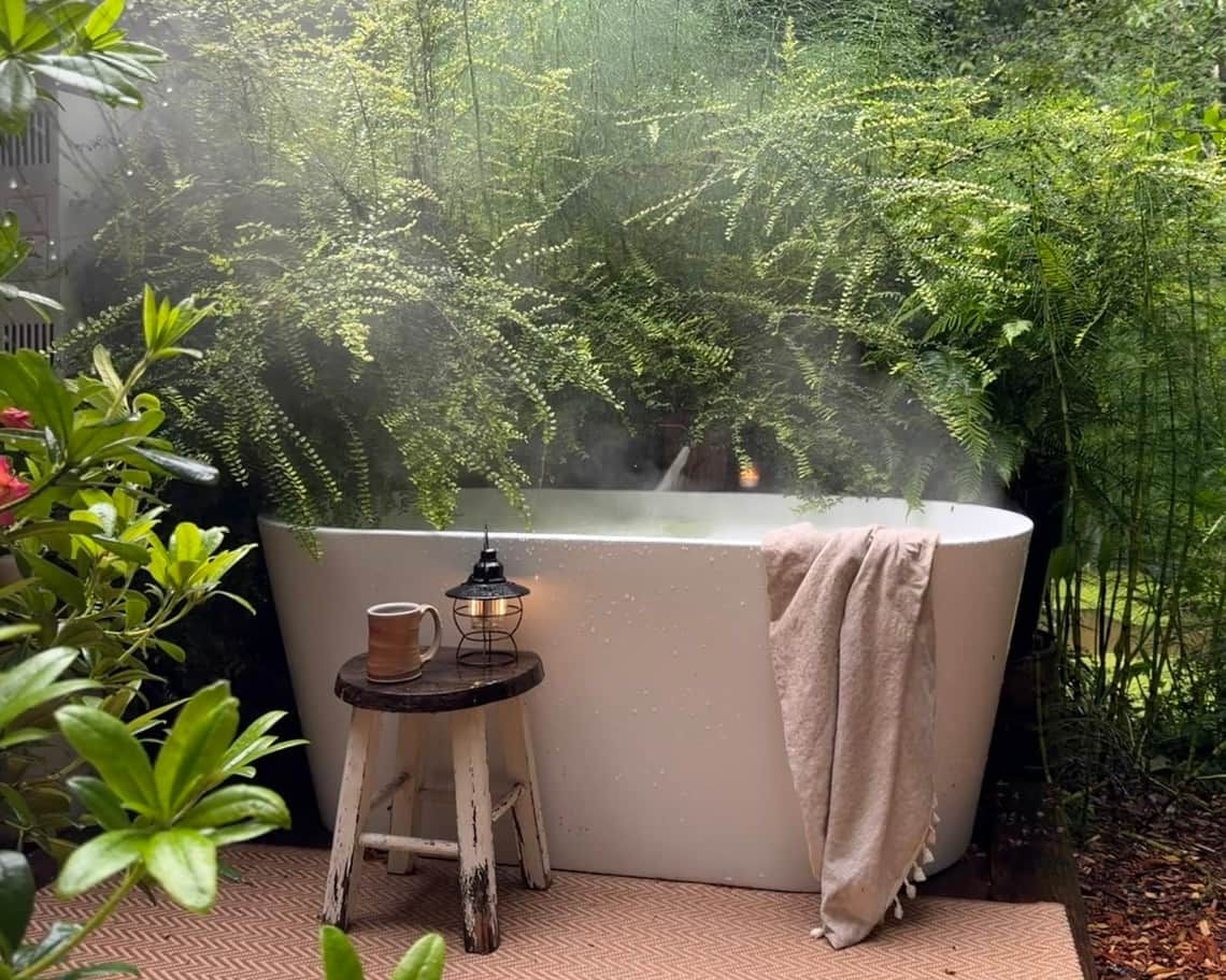 A warm outdoor soak, tucked among the ferns