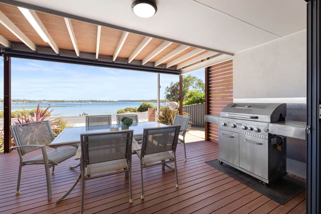 There is a six seater outdoor setting and a five burner gas bbq over looking the bay.0 H0 A1987