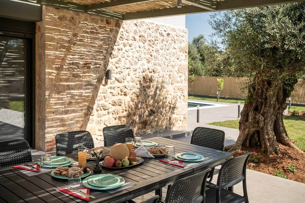 Kitchen patio with outdoors dining table