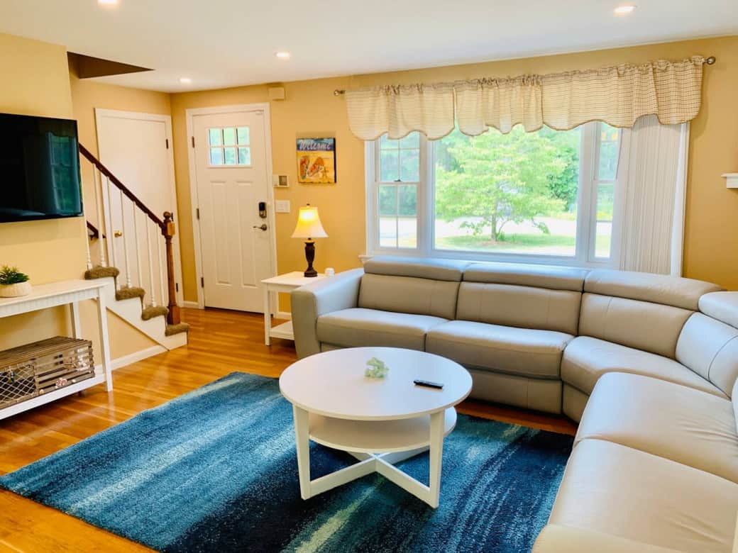 Bright and spacious living room with plush seating and natural light, perfect for relaxing, family gatherings, or cozy nights during your Cape Cod getaway. Bright and spacious living room with plush seating and natural light, perfect for relaxing, family gatherings, or cozy nights during your Cape Cod getaway.