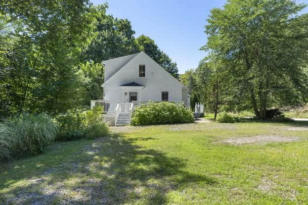 Left side of home, large driveway