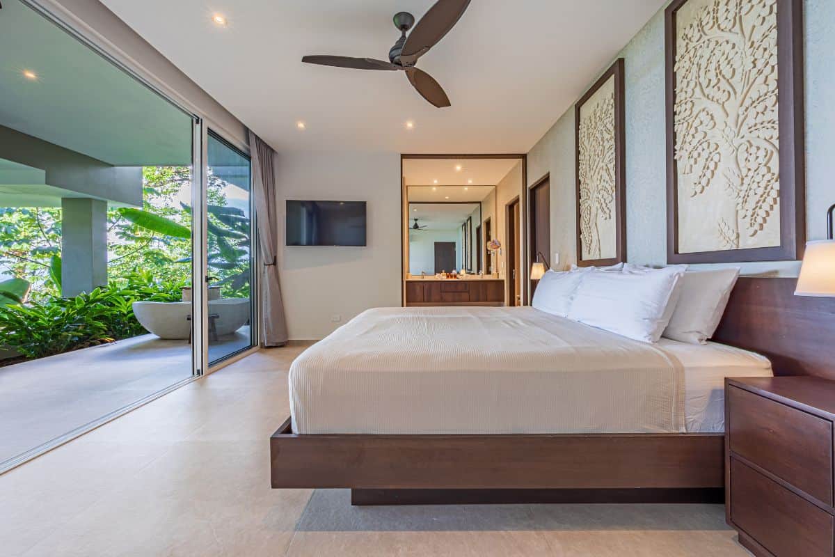 Bedroom with ensuite bathroom, walk-in wardrobe and terrace with outdoor bath tub at Villa Sueño.
