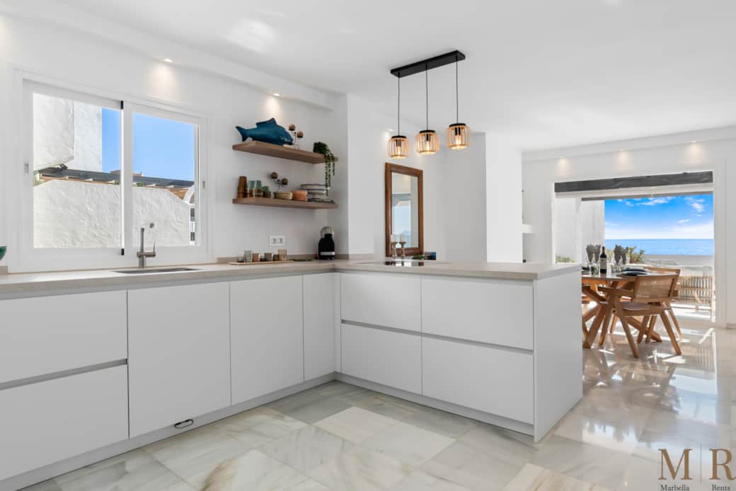 Fully equipped kitchen with dining area.