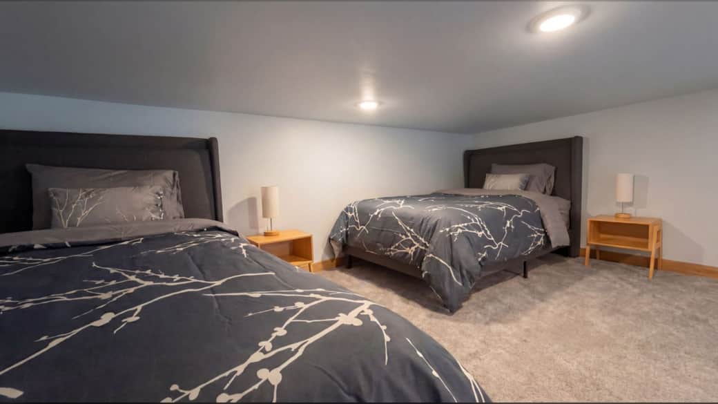 Airy view of the loft sleeping area which overlooks the main level in the Black Hills, SD.