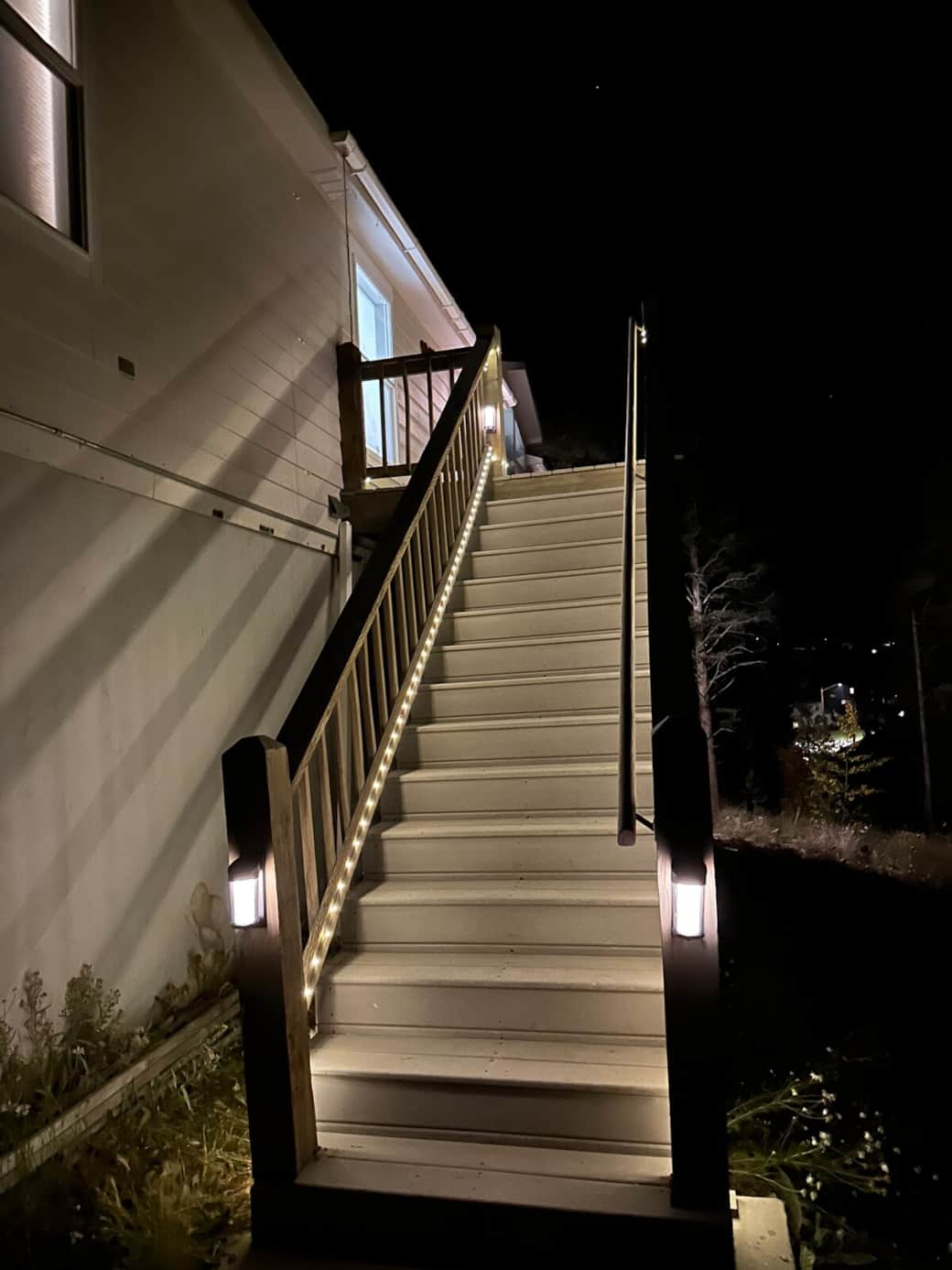 Stairs to front door are well lit at night from dusk to dawn