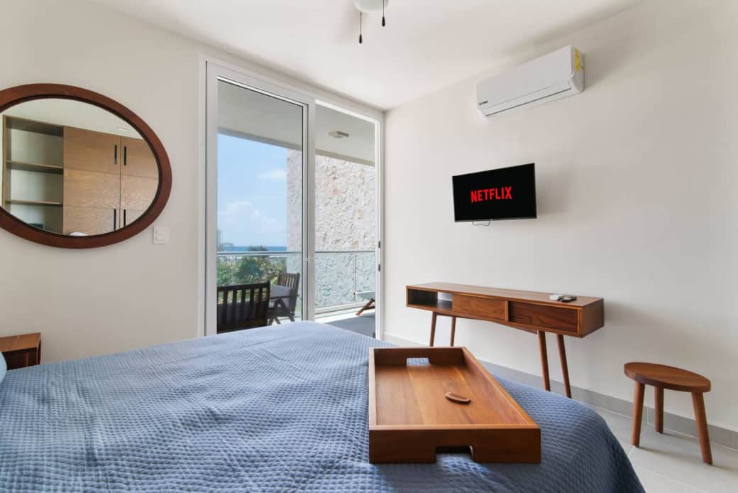 Wake up on this king-size bed, step out onto your private balcony.