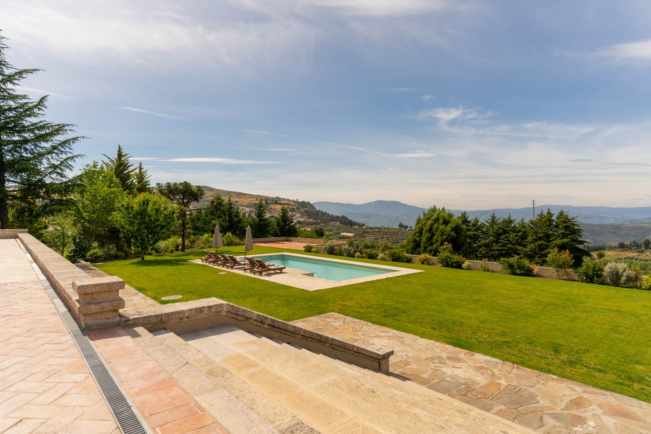 Golden hour over the pool terrace at Casa da Raposeira, Douro Valley