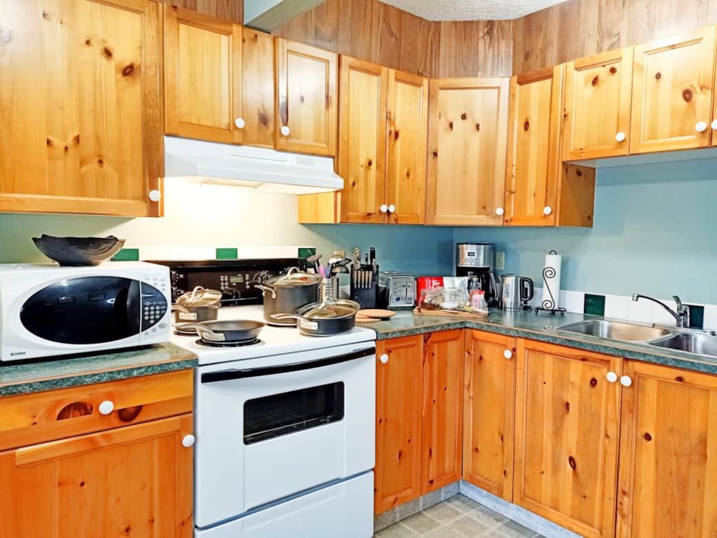 Spacious kitchen with all tools, cookware, and appliances for family meals