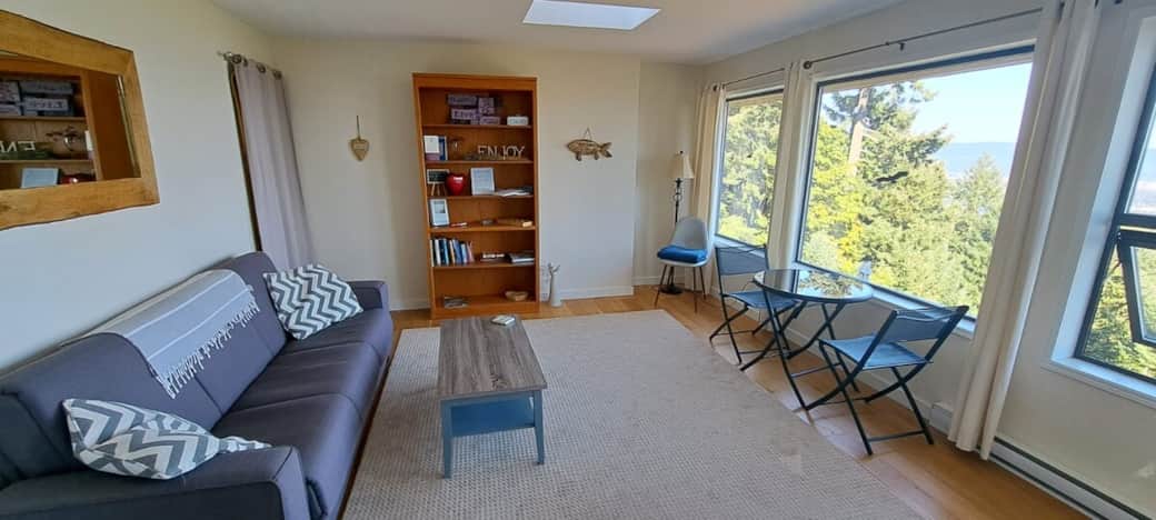 Full size living room with ocean vistas Full size living room with ocean vistas