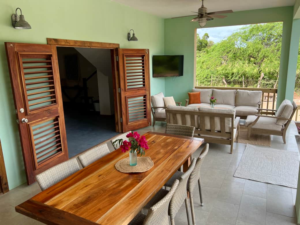 Comfortable and convenient veranda seating area for relaxing poolside