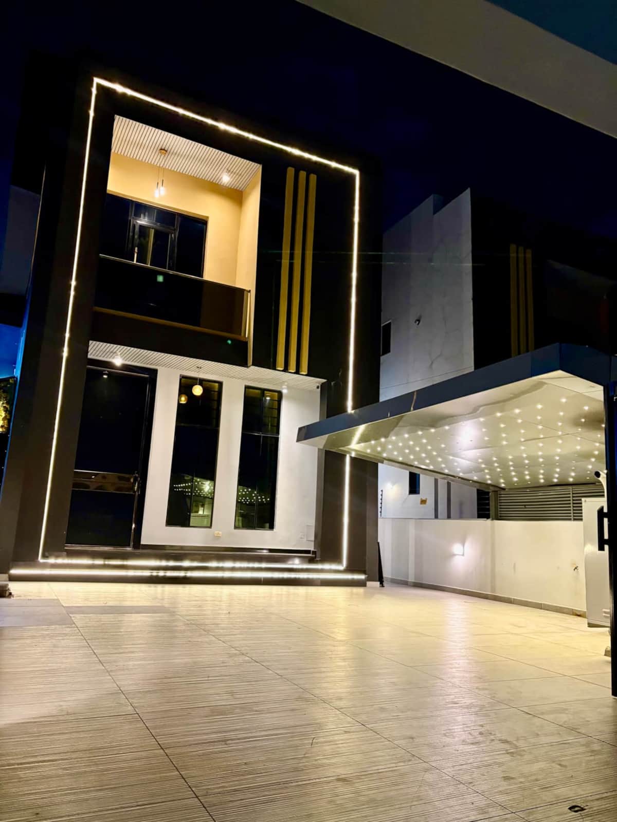 Jaiye Villa exterior illuminated at night