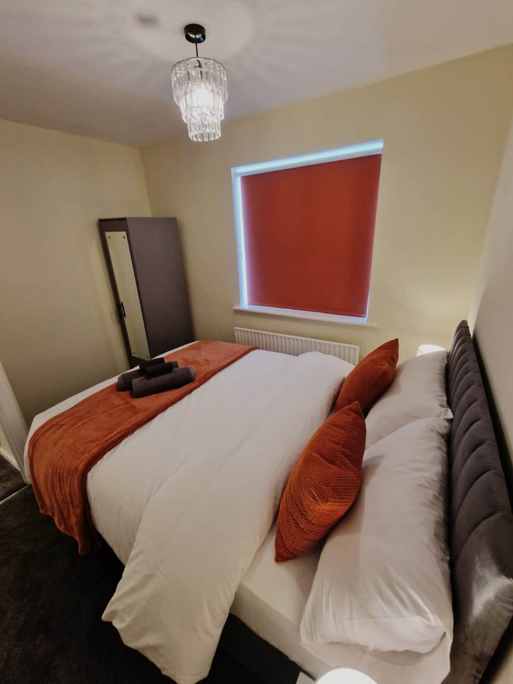 Second bedroom with comfortable double bed with mirrored wardrobe.