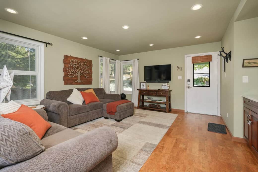 Spacious living room includes high end couches and a large SMART TV. Spacious living room includes high end couches and a large SMART TV.