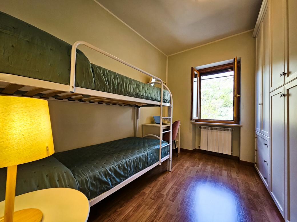 Bedroom with bunk bed and workstation Bedroom with bunk bed and workstation