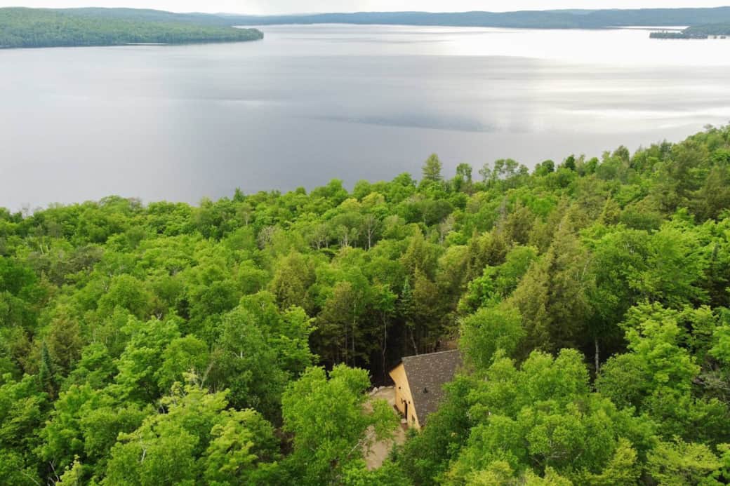 Barkview Hideaway is perched upon a cliff with western exposure overlooking Bark Lake. Private location nestled in the forest. Best of both worlds, Privacy being nestled in the forest and access to waterfront at our dock.