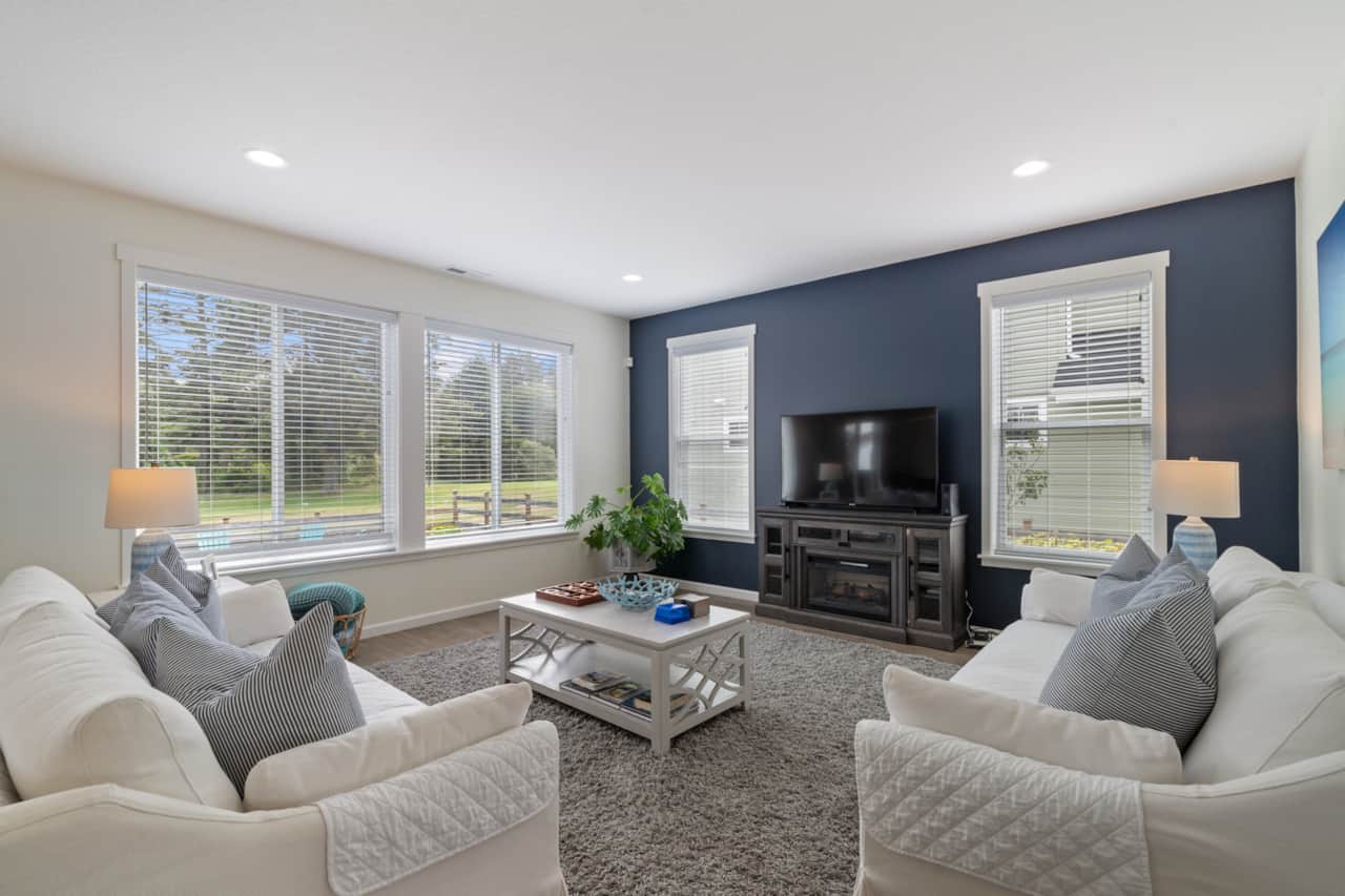 Plenty of seating and natural light make the living room the perfect spot to enjoy time together.