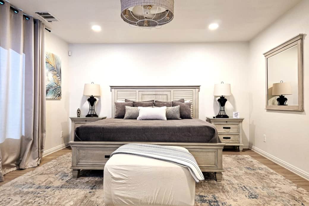Enjoy stunning mountain views in our cozy master retreat featuring a comfortable bed for a restful stay. Second-floor Primary suite with a King-sized bed, 75" Smart TV, ceiling fan, large walk-in closet and an ensuite bathroom with walk-in shower.