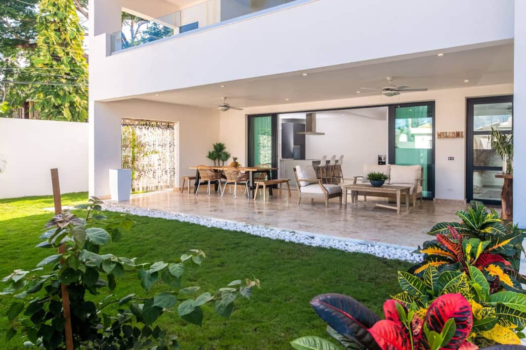 Large open patio with open air sitting and dining area